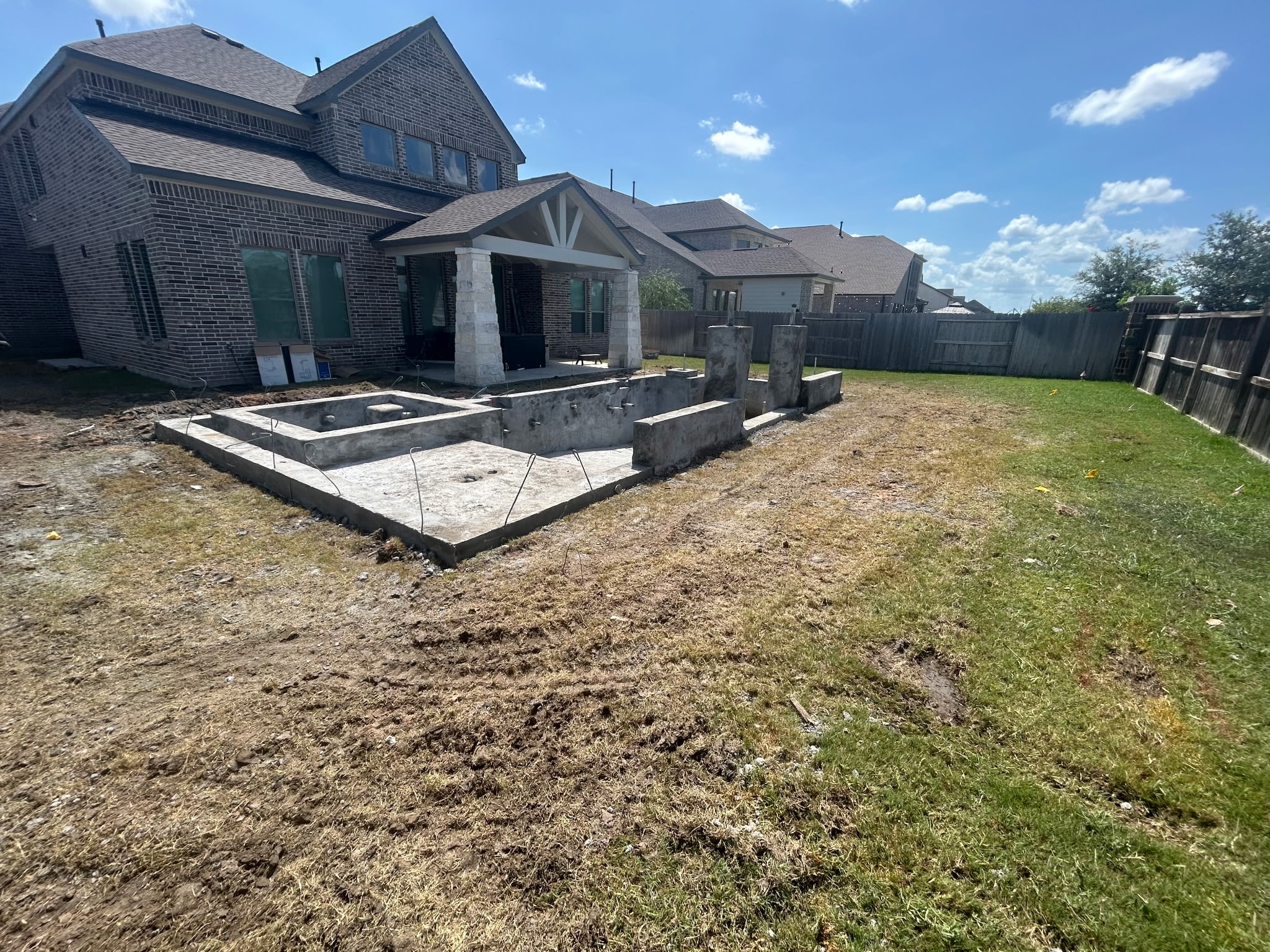 Pool construction site — outdoor grading and cleanup work
